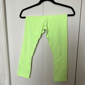 Highlighter yellow lululemon crop wunder under leggings.